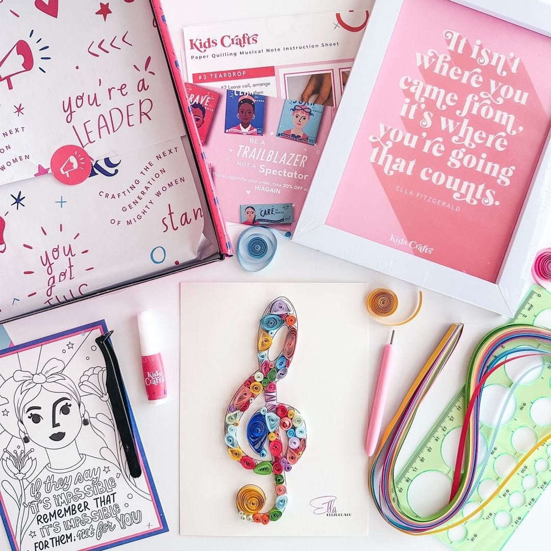 A flat-lay display of the beautiful paper quilling music note craft and all the motivational items inside the Kids Crafts box.