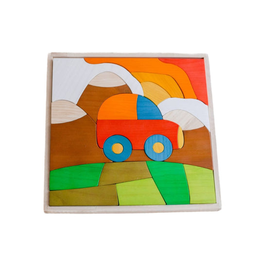 A colorful wooden puzzle set of a car with a sun setting behind mountains.