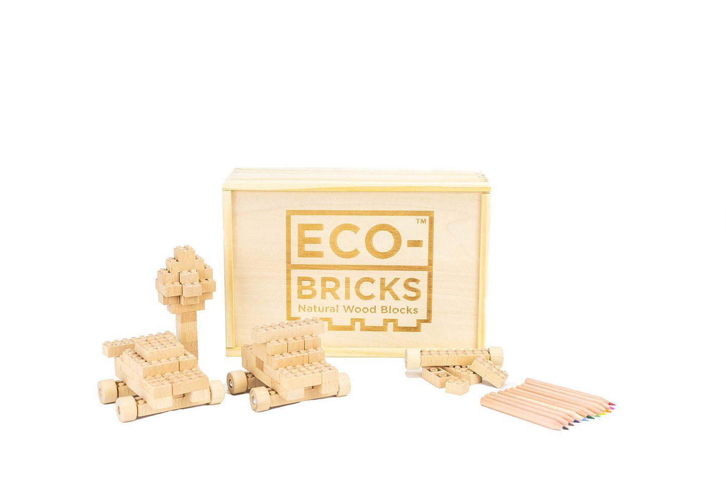 The front of the Eco-Bricks Natural Wood Blocks in front of the box are objects built with the bricks: a tree, two vehicles, and 10 colored pencils.