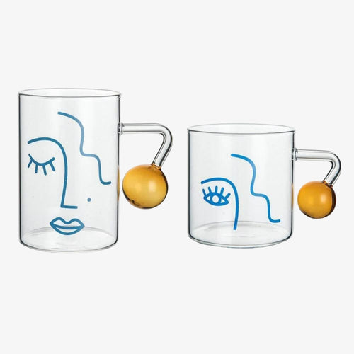 A side by side of the high abstract mug and the short abstract mug.