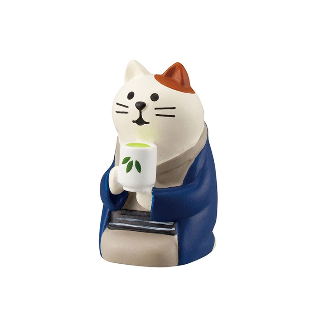 Pawsome figurines #240 cat drinking matcha wearing a blue cardigan.