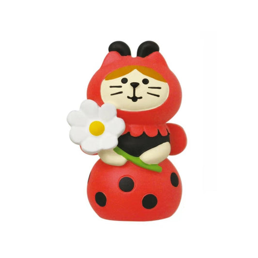 The Pawsome Figurines #80 wearing a ladybug attire and holding a daisy flower.