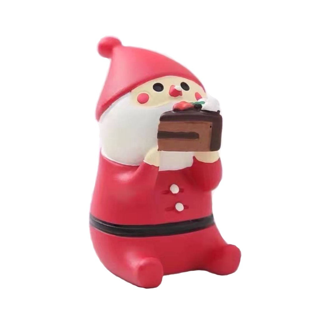 Pawsome Figurine 175 of Santa eating a slice of chocolate cake with a dollop of whipped cream on the tip of his nose.