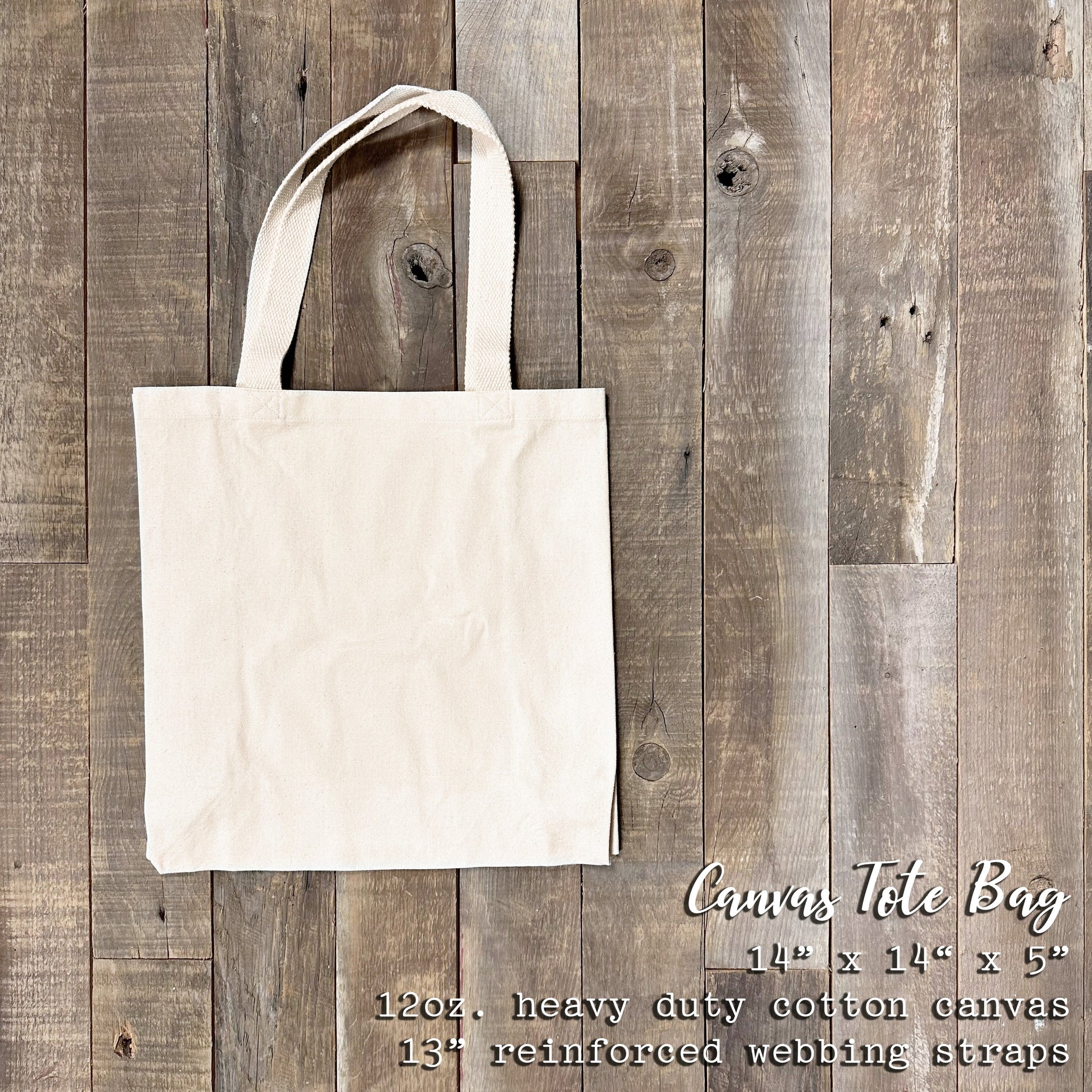 Size descriptions of the Canvas Tote Bag. 14" x 14" x 5" 12oz. heavy duty cotton canvas 13" reinforced webbing straps.