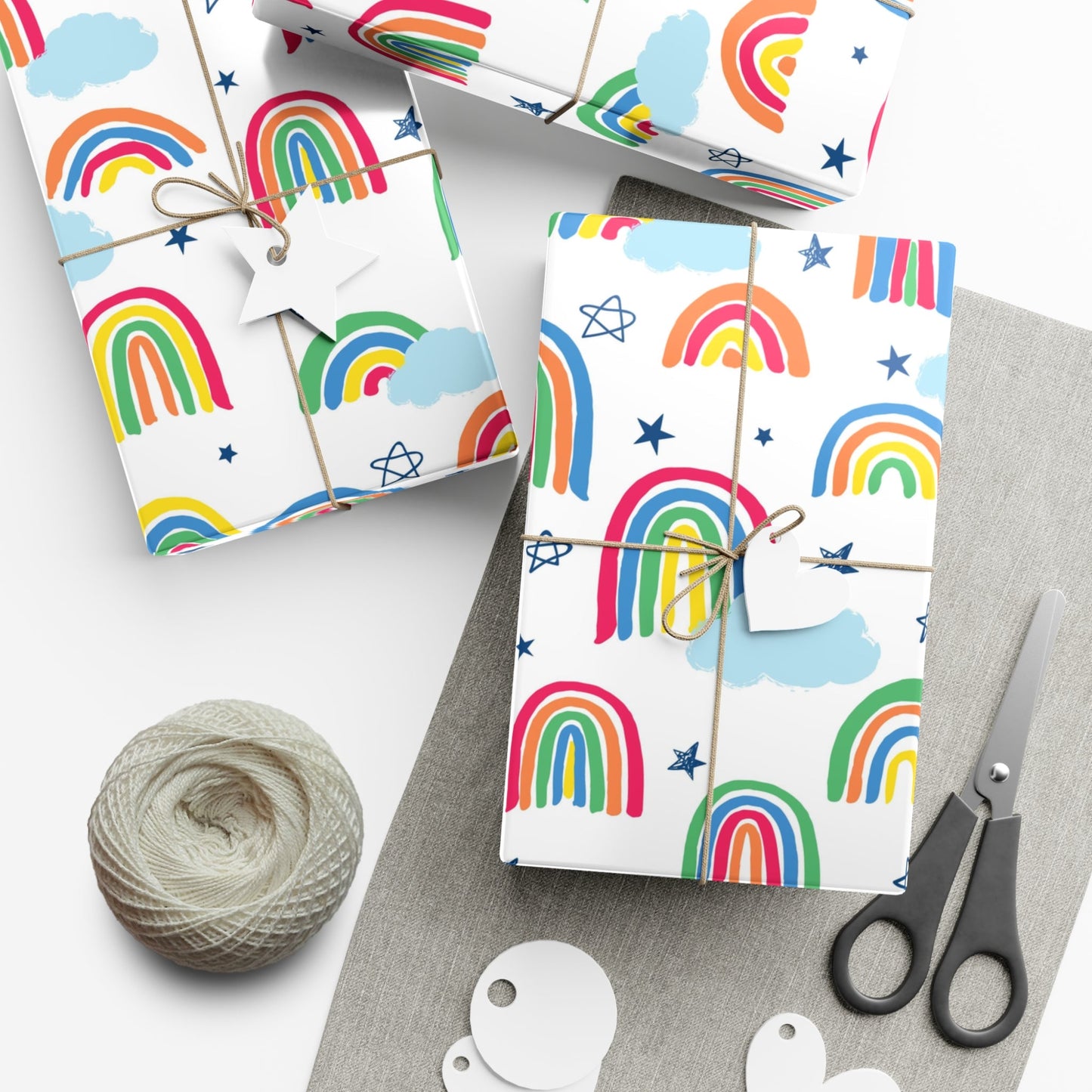 Display of the Rainbow gift wrapping paper. The rainbows mix their order of the colors, white background, and scattered clouds.