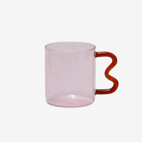 The A style of the Retro Wavy Mug available at Kangyco.com. The mug is made of glass in a translucent pink, and the mug handle is ergonomically wavy design in red.