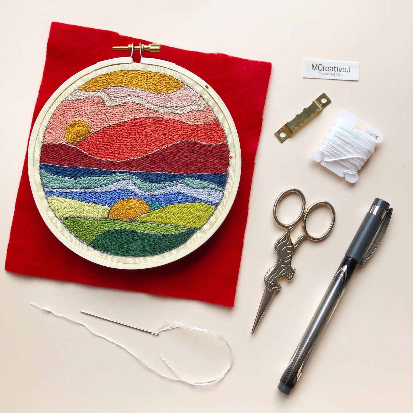 The completed Stained Glass Landscape Embroidery Kit available at KangyCo.com.