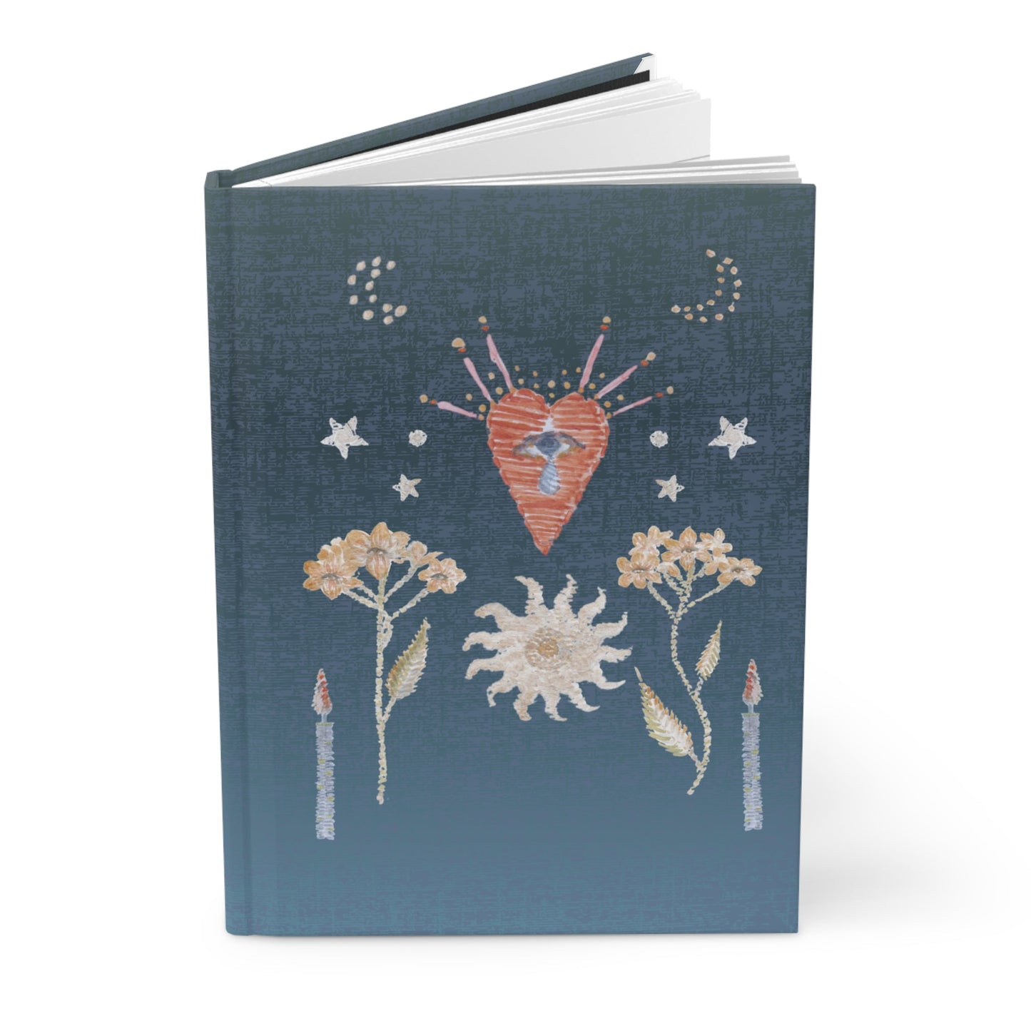 Gorgeous journal with a sacred heart in the middle and moons and flowers some starts the sun and two candles on the front cover.