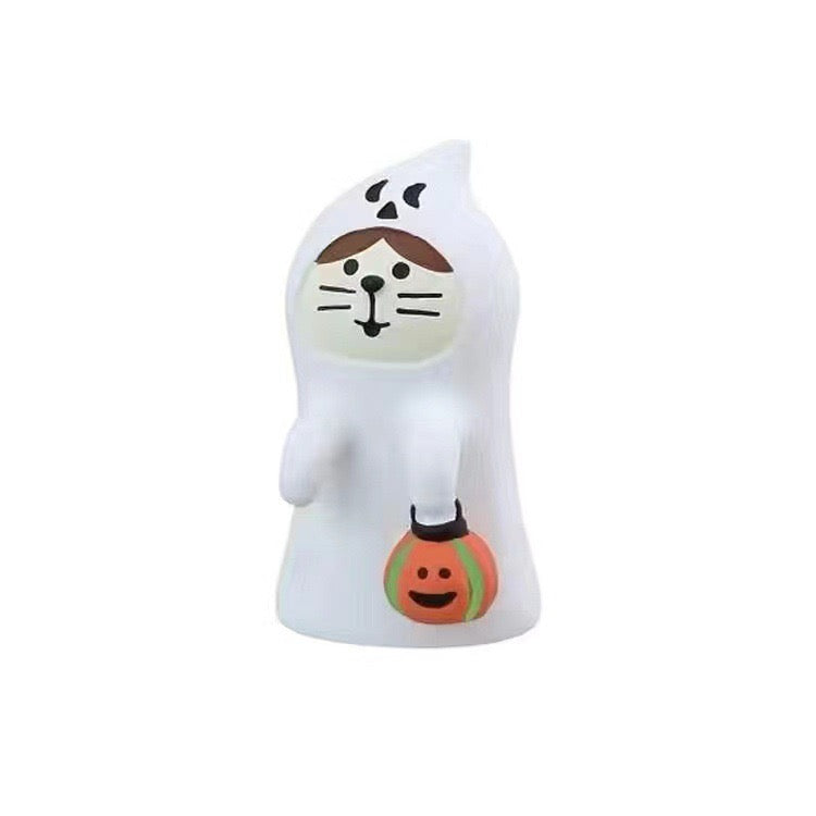 Pawsome Polymer Clay Figurine dressed in a ghost costume with a pumpkin trick-or-treat bag available at KangyCo.