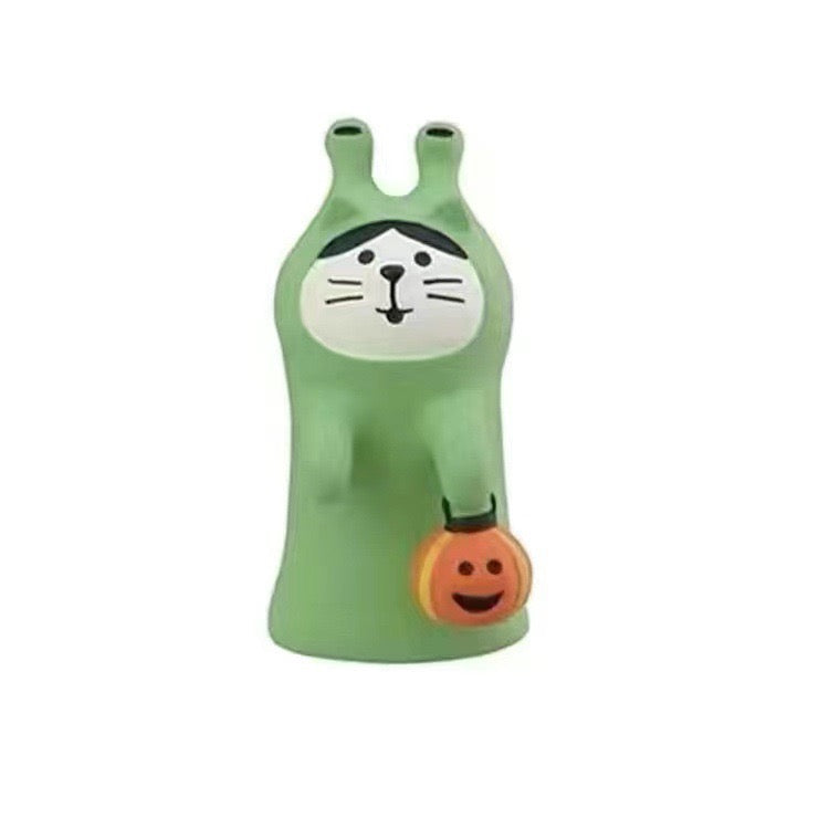 Pawsome figurine ready for Halloween dressed in an alien costume with a trick-or-treat pumpkin available at KangyCo.