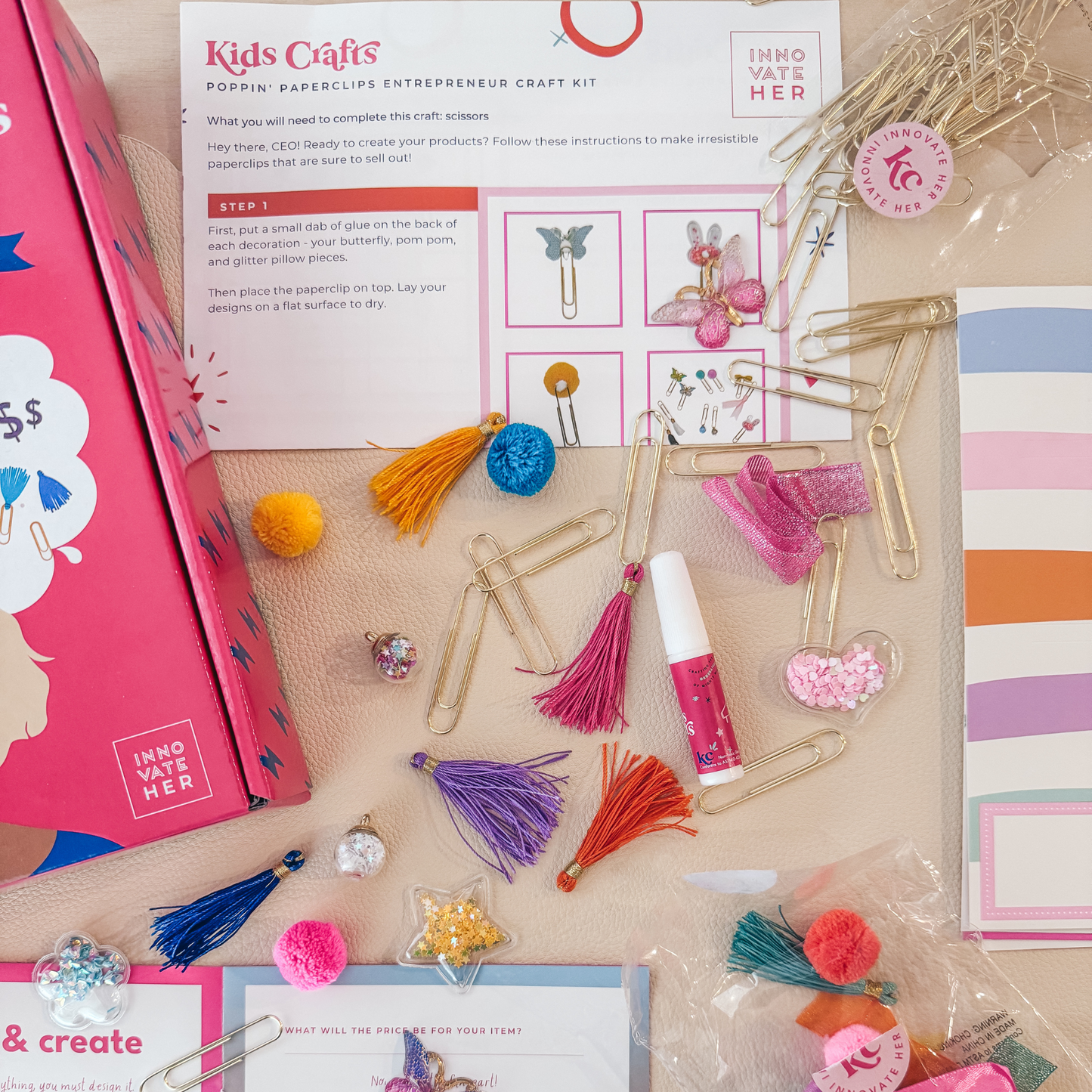 Displayed are all the items you will need to make and sell your items from the Paper Clip Kit. From tassels to paper clips and pom-poms.