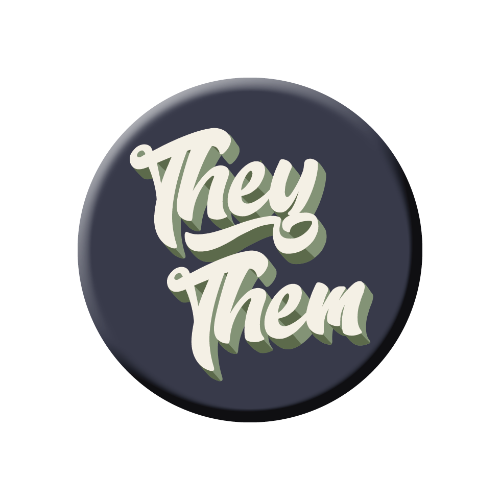 An enamel pin with the text "They Them" written in cursive.